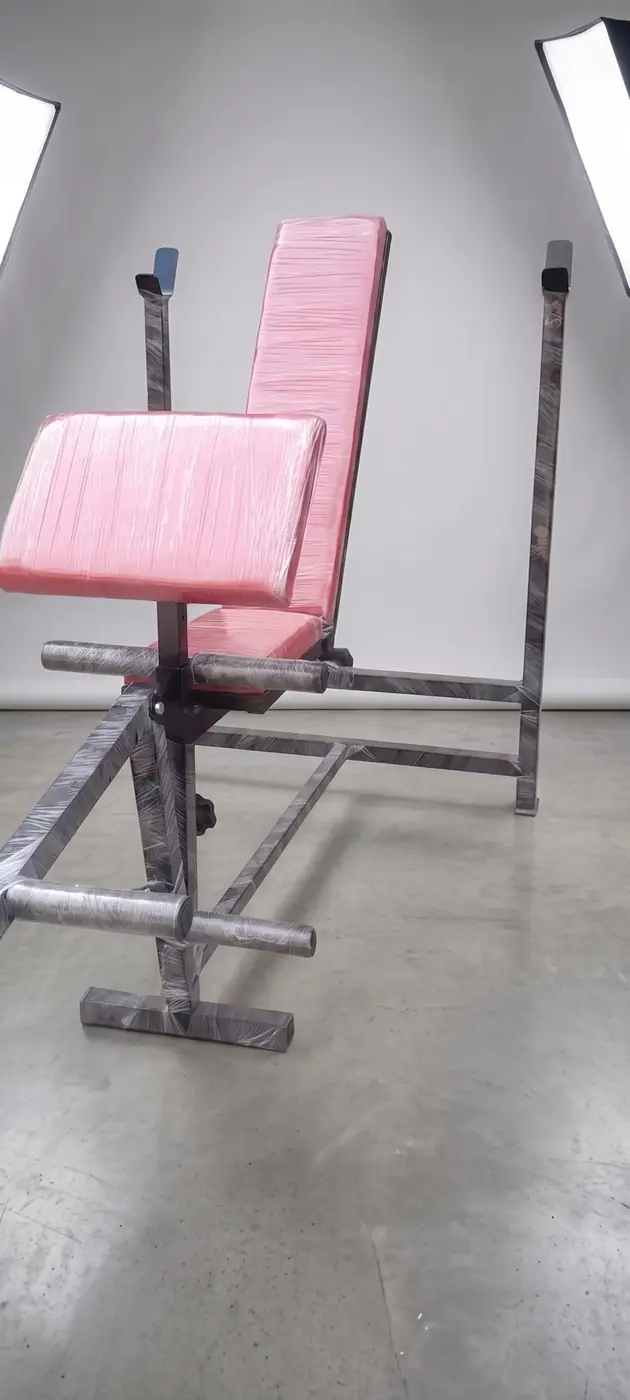 Adjustable multi bench side view with padded seat and barbell rack