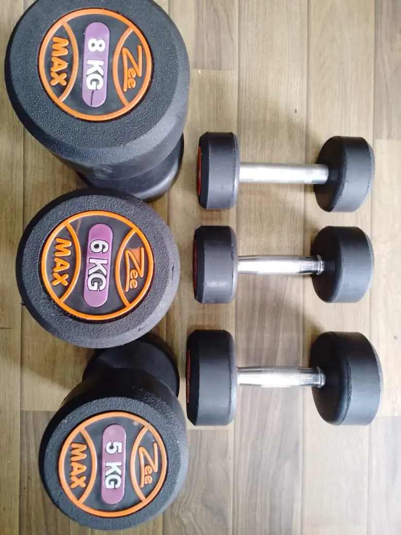 Rubber dumbbells with 5 kg 6 kg and 8 kg labeled weight plates